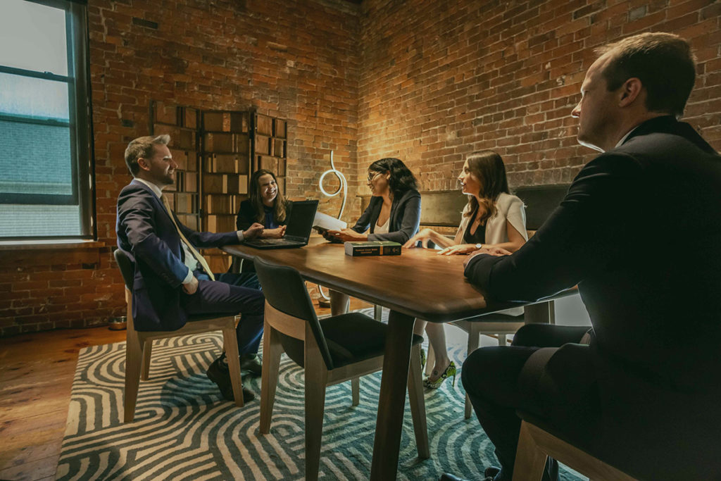 burke law team in an exposed-brick office